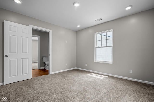 1825 E Maryland St, Indianapolis, IN 46201 - unfurnished bedroom with carpet, baseboards, and recessed lighting