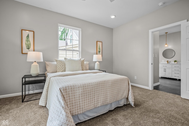 1825 E Maryland St, Indianapolis, IN 46201 - carpeted bedroom with baseboards and connected bathroom