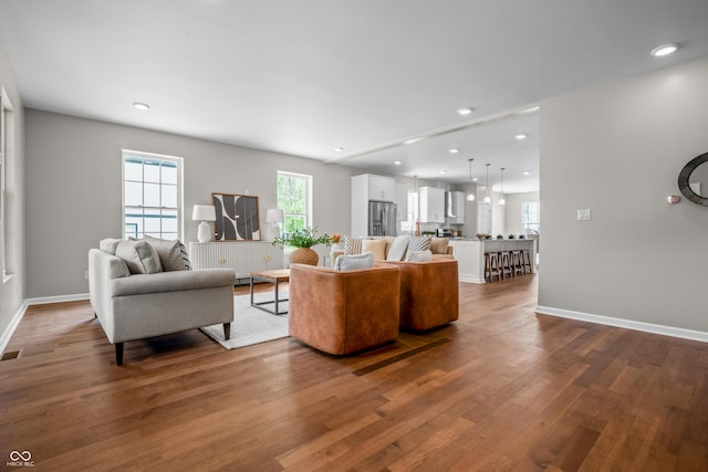 1825 E Maryland St, Indianapolis, IN 46201 - living area with dark wood-type flooring, baseboards, and recessed lighting