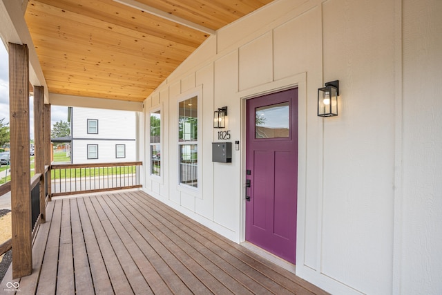 1825 E Maryland St, Indianapolis, IN 46201 - view of exterior entry featuring covered porch and board and batten siding