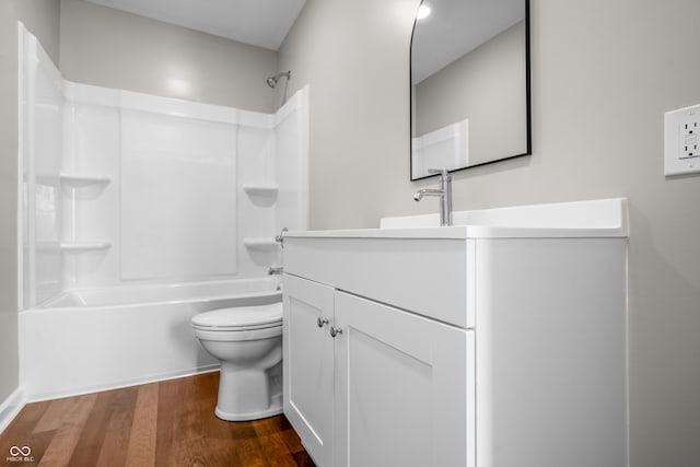 1825 E Maryland St, Indianapolis, IN 46201 - bathroom with toilet, vanity, wood finished floors, and washtub / shower combination