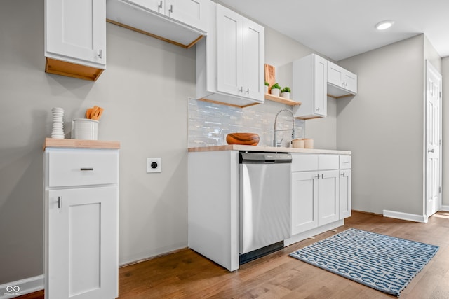 1825 E Maryland St, Indianapolis, IN 46201 - kitchen featuring dishwasher, wood finished floors, white cabinetry, and backsplash