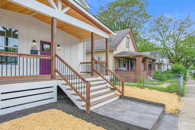 1825 E Maryland St, Indianapolis, IN 46201 - entrance to property with a porch and roof with shingles