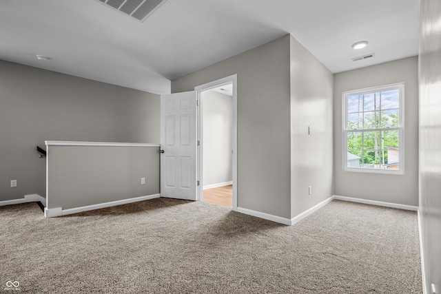 1825 E Maryland St, Indianapolis, IN 46201 - carpeted spare room with baseboards and a smoke detector