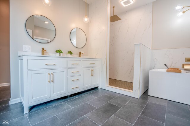 1825 E Maryland St, Indianapolis, IN 46201 - bathroom featuring a marble finish shower, double vanity, a soaking tub, and tile walls