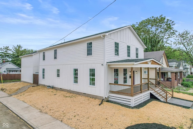 1825 E Maryland St, Indianapolis, IN 46201 - view of front facade featuring board and batten siding, a porch, and crawl space