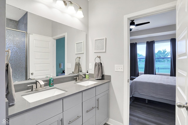 3592 Gillsland Rd, Bargersville, IN 46106 - ensuite bathroom featuring double vanity, wood finished floors, a shower with shower door, and baseboards