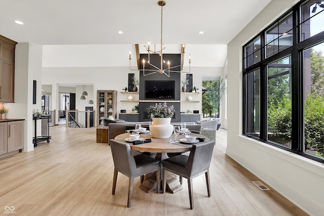 7116 Trail Ridge Ln, Indianapolis, IN 46259 - dining space featuring light wood-style floors, a chandelier, and recessed lighting