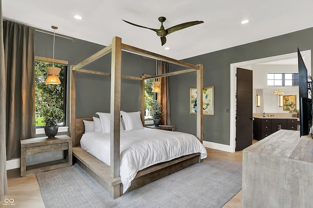 7116 Trail Ridge Ln, Indianapolis, IN 46259 - bedroom featuring light wood-type flooring, recessed lighting, connected bathroom, and a ceiling fan