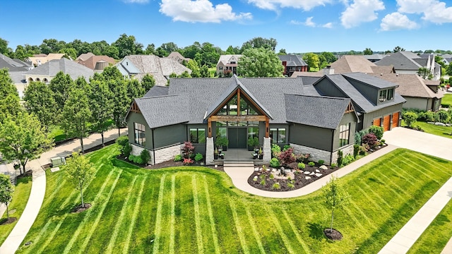 7116 Trail Ridge Ln, Indianapolis, IN 46259 - view of front of house featuring stone siding, roof with shingles, and a residential view
