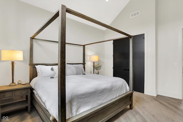 7116 Trail Ridge Ln, Indianapolis, IN 46259 - bedroom featuring light wood-style flooring and lofted ceiling