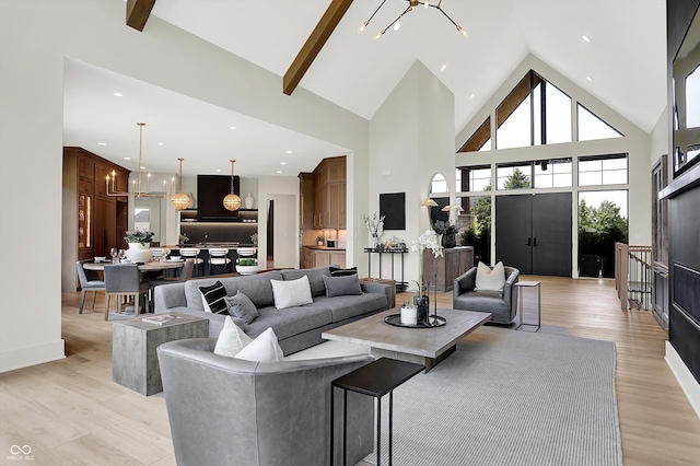 7116 Trail Ridge Ln, Indianapolis, IN 46259 - living area featuring high vaulted ceiling, a chandelier, light wood finished floors, and recessed lighting