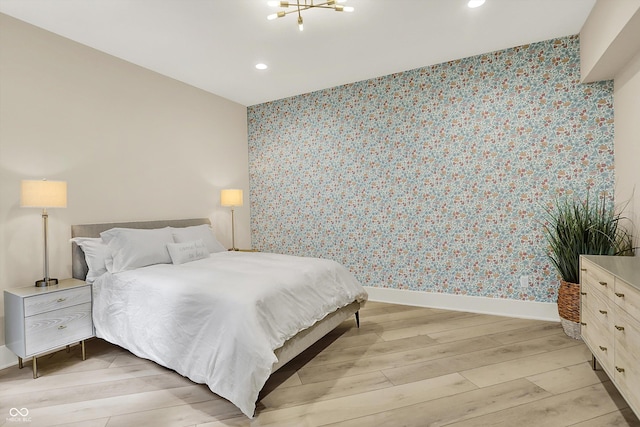 7116 Trail Ridge Ln, Indianapolis, IN 46259 - bedroom featuring wallpapered walls, light wood-style floors, recessed lighting, and an accent wall