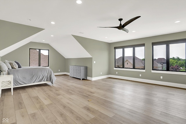 7116 Trail Ridge Ln, Indianapolis, IN 46259 - bedroom with multiple windows, light wood-style floors, a ceiling fan, recessed lighting, and lofted ceiling