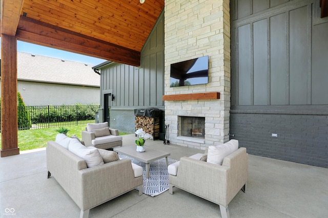 7116 Trail Ridge Ln, Indianapolis, IN 46259 - view of patio / terrace with an outdoor living space with a fireplace