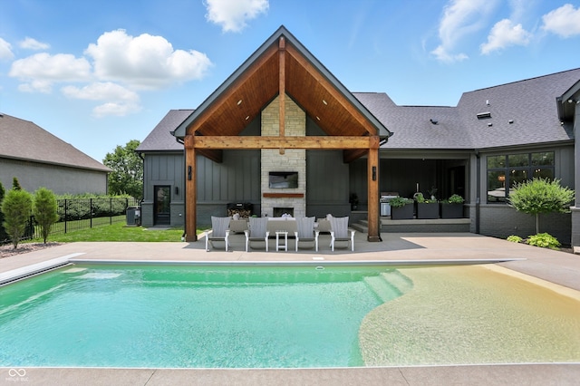 7116 Trail Ridge Ln, Indianapolis, IN 46259 - rear view of property featuring a patio area, board and batten siding, an outdoor pool, and a shingled roof