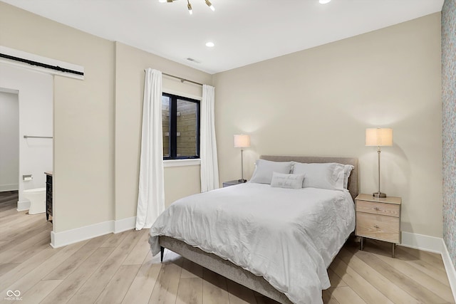 7116 Trail Ridge Ln, Indianapolis, IN 46259 - bedroom featuring light wood-style flooring, a barn door, and recessed lighting