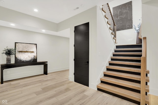 7116 Trail Ridge Ln, Indianapolis, IN 46259 - stairs with wood finished floors and recessed lighting