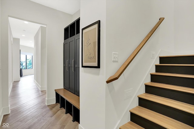 7116 Trail Ridge Ln, Indianapolis, IN 46259 - stairway with wood finished floors and recessed lighting