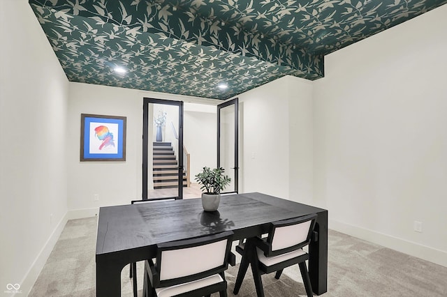 7116 Trail Ridge Ln, Indianapolis, IN 46259 - carpeted dining area featuring stairs and baseboards