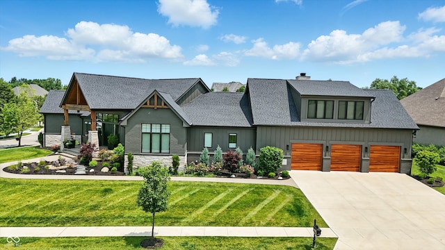 7116 Trail Ridge Ln, Indianapolis, IN 46259 - view of front of home featuring driveway, a front lawn, roof with shingles, stone siding, and board and batten siding