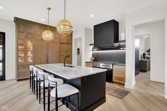 7116 Trail Ridge Ln, Indianapolis, IN 46259 - kitchen featuring high end stainless steel range, wall chimney range hood, a chandelier, light wood-type flooring, and recessed lighting