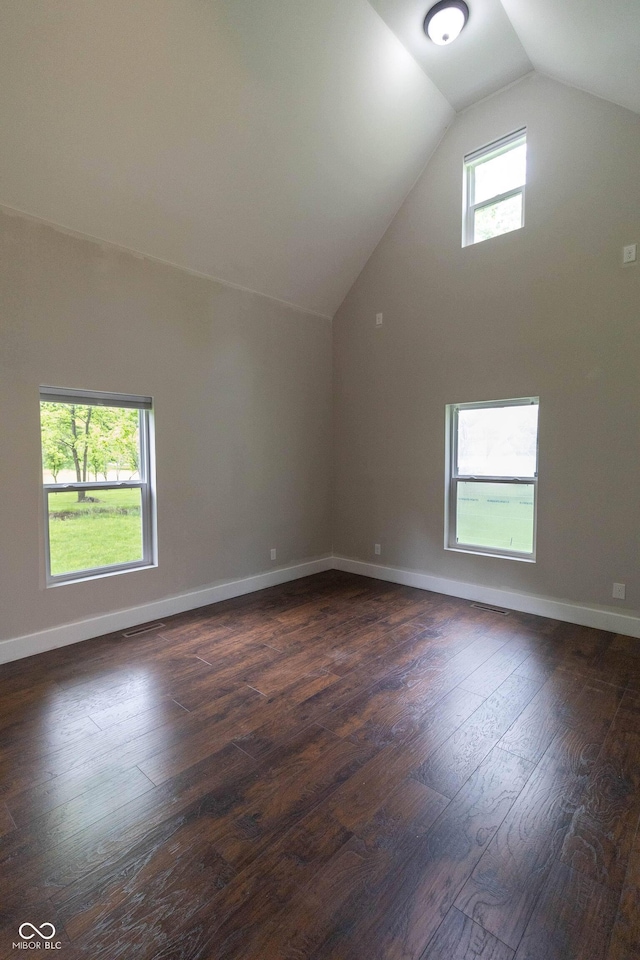2935 N Grizzly Ln, Martinsville, IN 46151 - unfurnished room with lofted ceiling, dark wood-style flooring, and baseboards