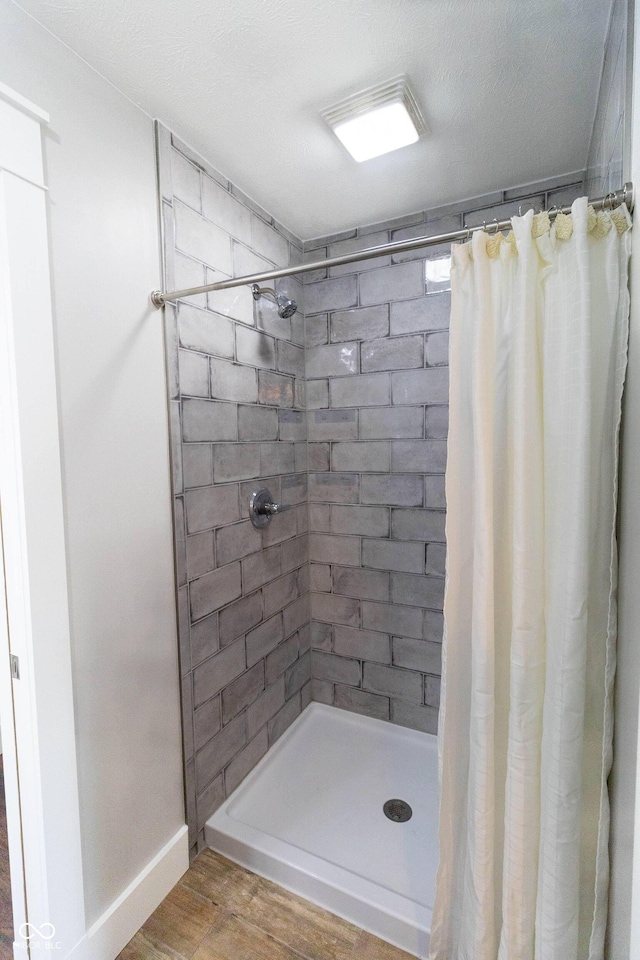 2935 N Grizzly Ln, Martinsville, IN 46151 - full bathroom with wood finished floors and a tile shower