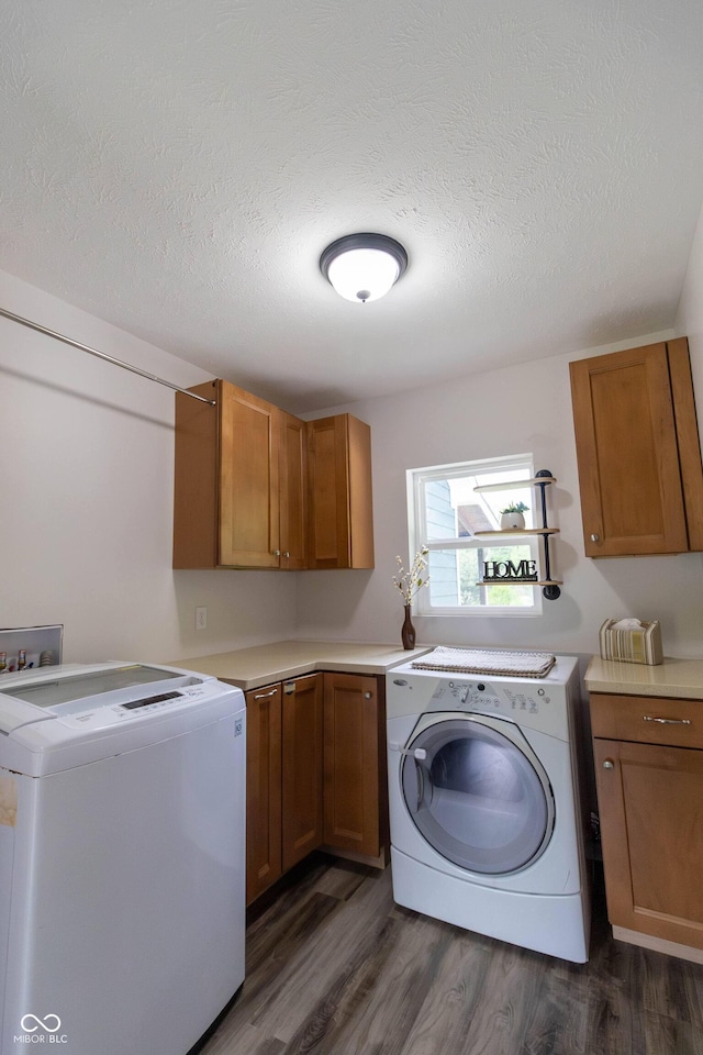 2935 N Grizzly Ln, Martinsville, IN 46151 - laundry room with cabinet space, dark wood-type flooring, separate washer and dryer, and a textured ceiling