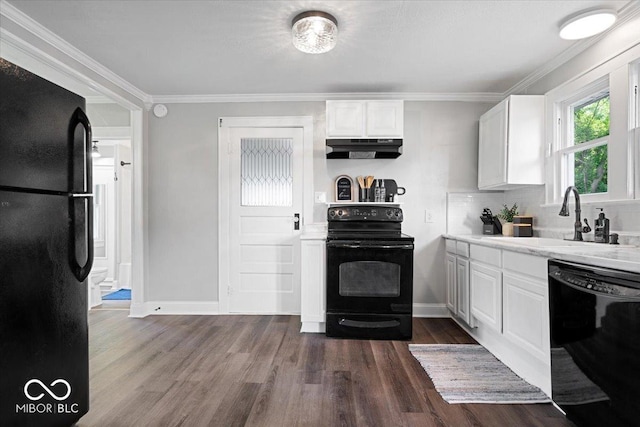 606 E County Line Rd, Indianapolis, IN 46227 - kitchen featuring black appliances, under cabinet range hood, dark wood-type flooring, white cabinets, and tasteful backsplash