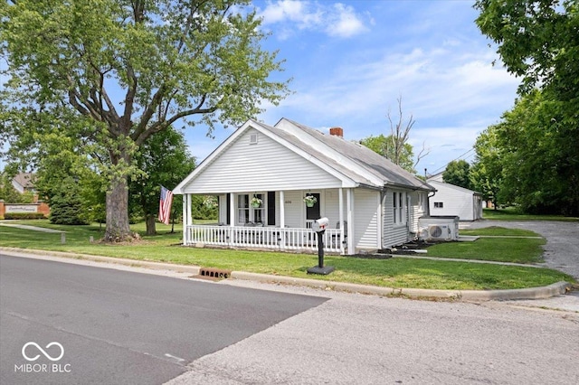 606 E County Line Rd, Indianapolis, IN 46227 - view of front of house featuring a porch, a front lawn, and a chimney