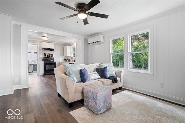 606 E County Line Rd, Indianapolis, IN 46227 - living room featuring a wall unit AC, dark wood-style floors, a ceiling fan, and ornamental molding