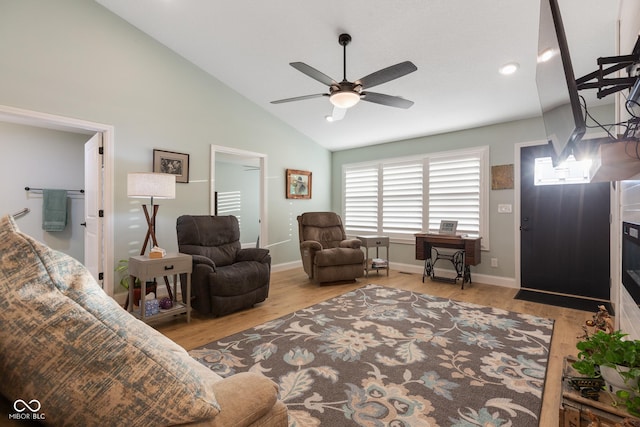 1959 Sophia Ln, Seymour, IN 47274 - living area with wood finished floors, a ceiling fan, baseboards, and high vaulted ceiling