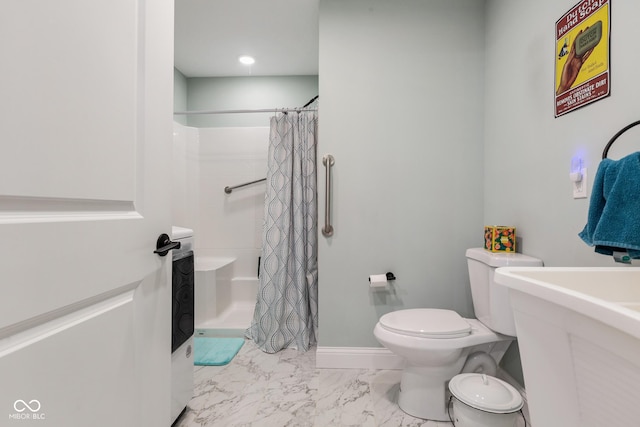 1959 Sophia Ln, Seymour, IN 47274 - bathroom featuring toilet, marble look tile flooring, and curtained shower