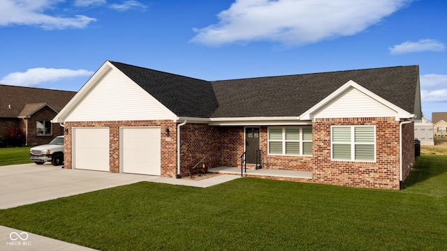 1959 Sophia Ln, Seymour, IN 47274 - view of front facade featuring an attached garage, concrete driveway, a front yard, brick siding, and a shingled roof