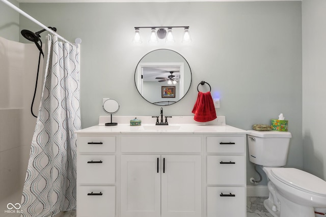 1959 Sophia Ln, Seymour, IN 47274 - full bath featuring ceiling fan, toilet, marble finish flooring, vanity, and baseboards