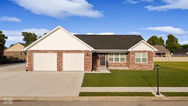 1959 Sophia Ln, Seymour, IN 47274 - view of front of house featuring a garage, concrete driveway, and brick siding