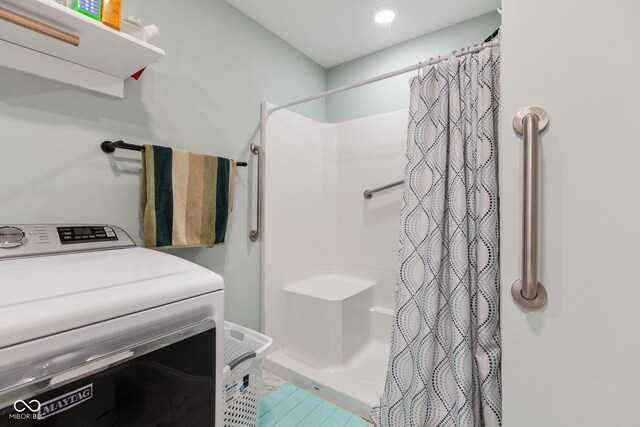 1959 Sophia Ln, Seymour, IN 47274 - bathroom featuring washer / clothes dryer and a stall shower
