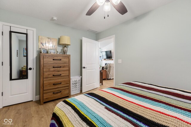 1959 Sophia Ln, Seymour, IN 47274 - bedroom with light wood-style flooring and a ceiling fan