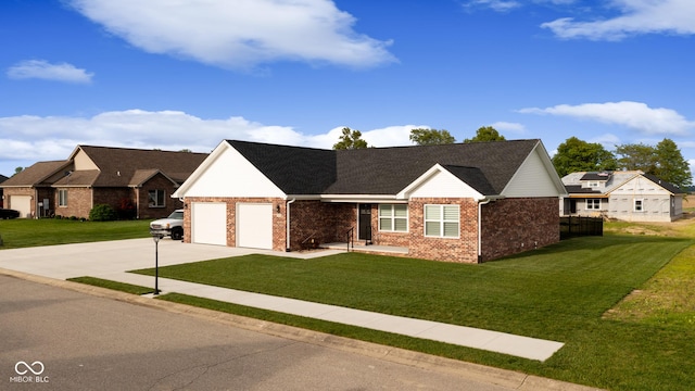 1959 Sophia Ln, Seymour, IN 47274 - ranch-style home featuring a front yard, concrete driveway, and brick siding