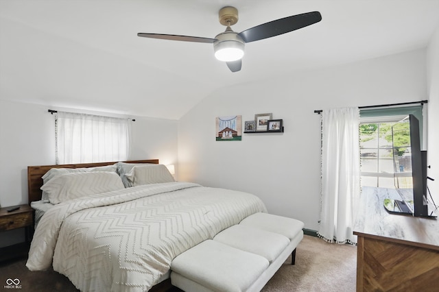 bedroom featuring lofted ceiling, light carpet, and ceiling fan