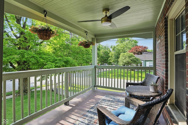 wooden deck with a ceiling fan
