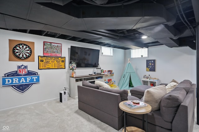 living area featuring light carpet