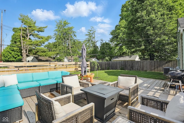 view of patio / terrace with an outdoor living space with a fire pit, a wooden deck, and cooling unit
