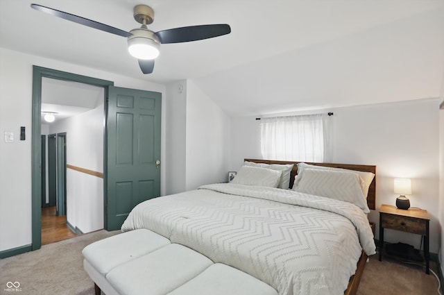 bedroom featuring carpet floors, a ceiling fan, and vaulted ceiling