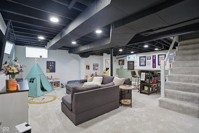 living room featuring carpet flooring and stairway