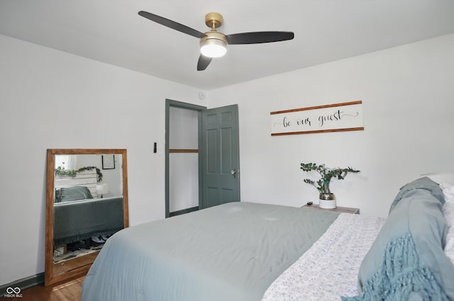 bedroom with wood finished floors and ceiling fan
