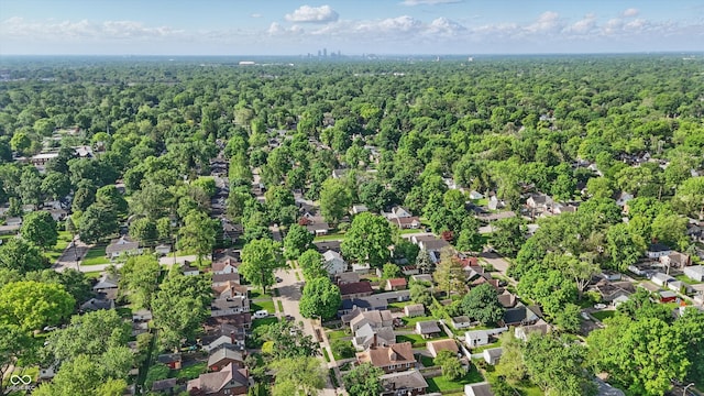 aerial overview of property's location with a heavily wooded area