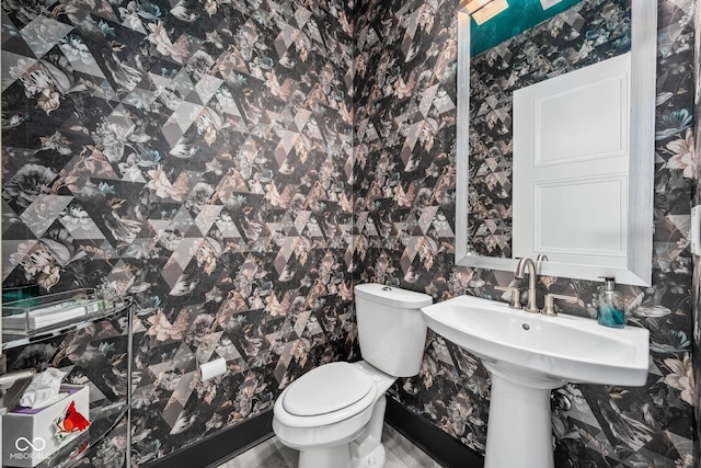 15 W Executive Dr Unit 101, Carmel, IN 46032 - half bathroom featuring toilet and wallpapered walls