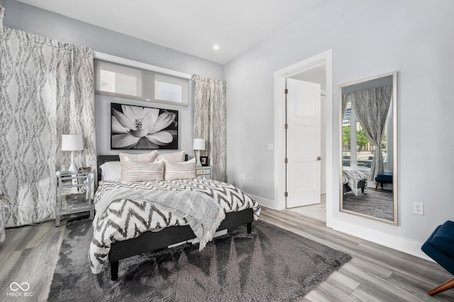 15 W Executive Dr Unit 101, Carmel, IN 46032 - bedroom with wood finished floors, baseboards, and recessed lighting